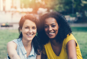 Young women outside together socialising